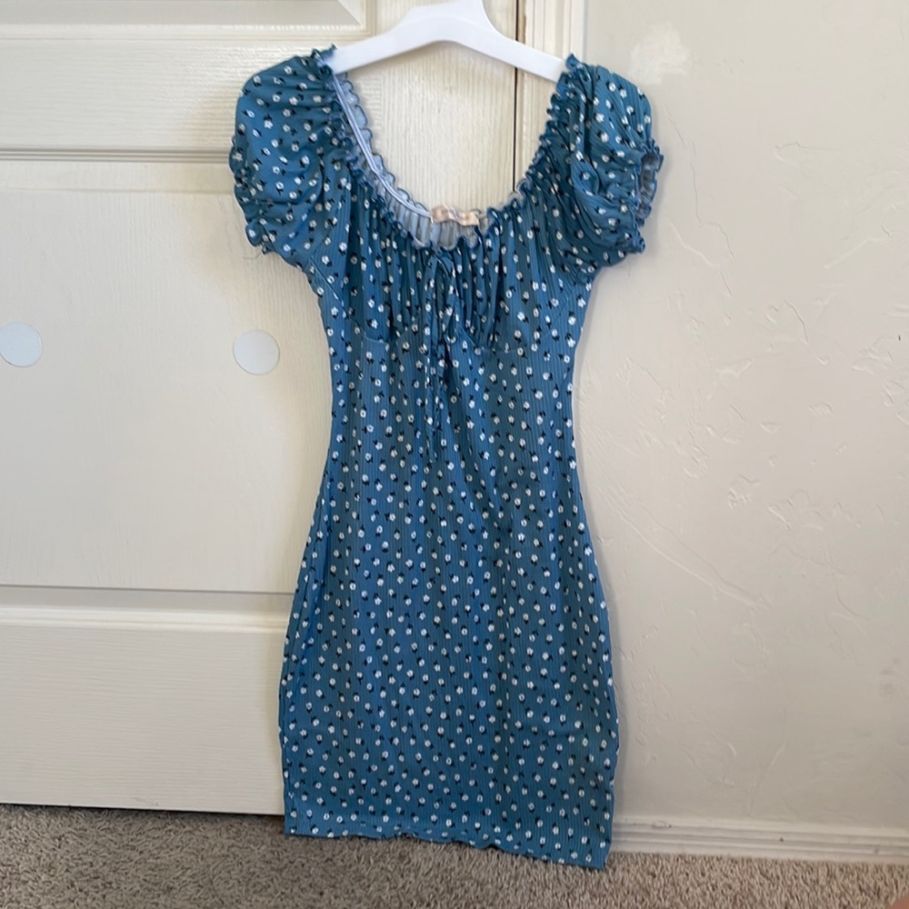bodycon flower mini dress. lettuce trim sleeve and neck line